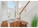 Bright foyer with hardwood floors, a soaring window, a staircase, and elegant details at 8965 Snowberry Ct, Zionsville, IN 46077