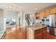 Open kitchen with a center island connecting to the living area at 8965 Snowberry Ct, Zionsville, IN 46077