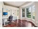 Home office with built-in shelving and bay window at 8965 Snowberry Ct, Zionsville, IN 46077