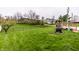 Expansive backyard with lush lawn and inviting deck area, ideal for outdoor living and entertaining at 8973 Sunningdale Blvd, Indianapolis, IN 46234