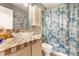 The bathroom features a unique glass bowl sink and a vibrant shower curtain with fish pattern at 8973 Sunningdale Blvd, Indianapolis, IN 46234