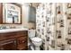 Cozy bathroom featuring charming seaside decor and a spacious vanity with storage at 8973 Sunningdale Blvd, Indianapolis, IN 46234