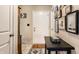 Inviting entryway with tiled floor, coat closet and a decorative table with artwork at 8973 Sunningdale Blvd, Indianapolis, IN 46234