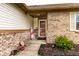 Charming entryway features a decorative front door and beautiful landscaping at 8973 Sunningdale Blvd, Indianapolis, IN 46234