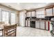Bright kitchen with white cabinets, modern appliances, and a cozy breakfast nook at 8973 Sunningdale Blvd, Indianapolis, IN 46234