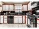 Updated kitchen featuring stylish black appliances and bright white cabinetry for a modern feel at 8973 Sunningdale Blvd, Indianapolis, IN 46234