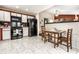 Spacious kitchen with modern appliances, tiled floors, and an adjacent dining area at 8973 Sunningdale Blvd, Indianapolis, IN 46234