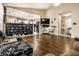 Bright living room showcasing wood floors and an open-concept design to the kitchen at 8973 Sunningdale Blvd, Indianapolis, IN 46234