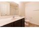 Bathroom with dark vanity, white countertops, a decorative mirror and tiled floors at 904 Adena Ln, Westfield, IN 46074