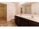 Bright bathroom featuring double sink vanity with dark cabinets at 904 Adena Ln, Westfield, IN 46074