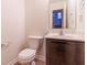 Bathroom with a toilet and vanity, featuring a marble countertop and neutral color scheme at 904 Adena Ln, Westfield, IN 46074