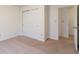 Bright bedroom with sliding door closet and a doorway leading to another room at 904 Adena Ln, Westfield, IN 46074