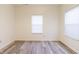 Neutral-toned bedroom with wood floors, large windows, and ample natural light, creating a serene atmosphere at 904 Adena Ln, Westfield, IN 46074