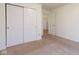 Bright bedroom featuring a closet with sliding doors and neutral carpet and wall colors at 904 Adena Ln, Westfield, IN 46074