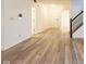 Welcoming entryway with wood flooring, a staircase, and a view of the front door, creating an inviting atmosphere at 904 Adena Ln, Westfield, IN 46074