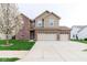 Charming two-story home featuring a three-car garage, well-maintained lawn, and a mix of brick and siding at 904 Adena Ln, Westfield, IN 46074