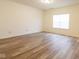 Bright living room featuring wood floors, neutral walls, and ample natural light, creating a comfortable living space at 904 Adena Ln, Westfield, IN 46074