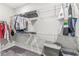 Walk-in closet with shelving and hanging rods for ample storage; organized clothing, shoes, and bins at 9925 Glendon Ct, McCordsville, IN 46055