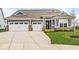 Beautiful home featuring a 3 car garage, nice landscaping, and a covered front porch at 9925 Glendon Ct, McCordsville, IN 46055