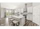 Open concept kitchen featuring a large island, stainless steel appliances, and white cabinets at 9925 Glendon Ct, McCordsville, IN 46055