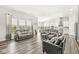 Spacious living room featuring hardwood floors and an open floor plan to the kitchen at 9925 Glendon Ct, McCordsville, IN 46055