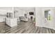 Open living space showcasing the kitchen, living room, and access to the backyard at 9925 Glendon Ct, McCordsville, IN 46055