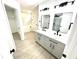 Bathroom with double sink vanity, light grey cabinets, and modern fixtures at 10200 Cheswick Ln, Fishers, IN 46037