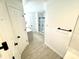 Bathroom featuring modern finishes and a walk-in shower with glass doors at 10200 Cheswick Ln, Fishers, IN 46037