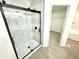 Bathroom showcasing a modern glass shower and walk in closet at 10200 Cheswick Ln, Fishers, IN 46037