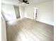 Bright bedroom featuring new light wood flooring and a ceiling fan at 10200 Cheswick Ln, Fishers, IN 46037