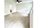 A bedroom features white walls, light-colored flooring, and a ceiling fan at 10200 Cheswick Ln, Fishers, IN 46037
