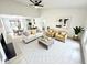 Bright living room boasts a high ceiling, neutral decor, and an open floor plan with plenty of natural light at 10200 Cheswick Ln, Fishers, IN 46037