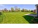 Expansive backyard featuring lush green grass and potential for outdoor activities and relaxation at 10602 Pintail Ln, Indianapolis, IN 46239