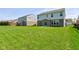 Large backyard view showcasing ample green space and potential for landscaping and recreation at 10602 Pintail Ln, Indianapolis, IN 46239