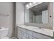 Bright bathroom with double sink vanity, white cabinets, and ample counter space at 10602 Pintail Ln, Indianapolis, IN 46239