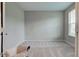 Neutral bedroom with plush carpet, a bright window, and ample natural light at 10602 Pintail Ln, Indianapolis, IN 46239