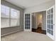 Bright bedroom with glass doors, and a bathroom at 10602 Pintail Ln, Indianapolis, IN 46239