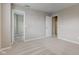 Spacious bedroom with multiple doorways and plush carpeting at 10602 Pintail Ln, Indianapolis, IN 46239