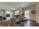 Open dining and living room area with a fireplace and ample seating at 10602 Pintail Ln, Indianapolis, IN 46239