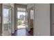 Bright entryway with hardwood floors, glass-paneled doors, and a view to the home's exterior at 10602 Pintail Ln, Indianapolis, IN 46239