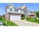 Inviting two-story home showcasing a two-car garage and manicured front yard at 10602 Pintail Ln, Indianapolis, IN 46239