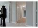 Upstairs hallway featuring neutral walls, carpeted floor, white doors and trim at 10602 Pintail Ln, Indianapolis, IN 46239