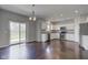 Eat-in kitchen with white cabinetry, stainless steel appliances, and access to the outdoor living space at 10602 Pintail Ln, Indianapolis, IN 46239