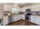 Bright kitchen featuring white cabinetry, stainless steel appliances, and a view from the window at 10602 Pintail Ln, Indianapolis, IN 46239