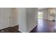 Bright living room featuring beautiful dark hardwood floors and access to outdoor area at 10602 Pintail Ln, Indianapolis, IN 46239
