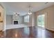 Inviting living space featuring a fireplace, hardwood floors, and sliding glass doors to the outdoors at 10602 Pintail Ln, Indianapolis, IN 46239