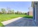 Concrete patio offering an outdoor living space with views of the expansive grassy backyard at 10602 Pintail Ln, Indianapolis, IN 46239