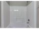 A shower featuring white walls and a chrome showerhead and faucet at 10602 Pintail Ln, Indianapolis, IN 46239