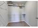 Walk-in closet with wire shelving, carpeted floor, and additional storage above at 10602 Pintail Ln, Indianapolis, IN 46239