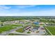 Wide aerial shot of a commercial area with various businesses, roads, and green spaces at 11054 N Shelby 490 W, New Palestine, IN 46163